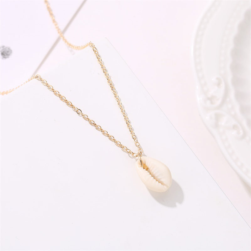 COWRIE SHELL PENDANT